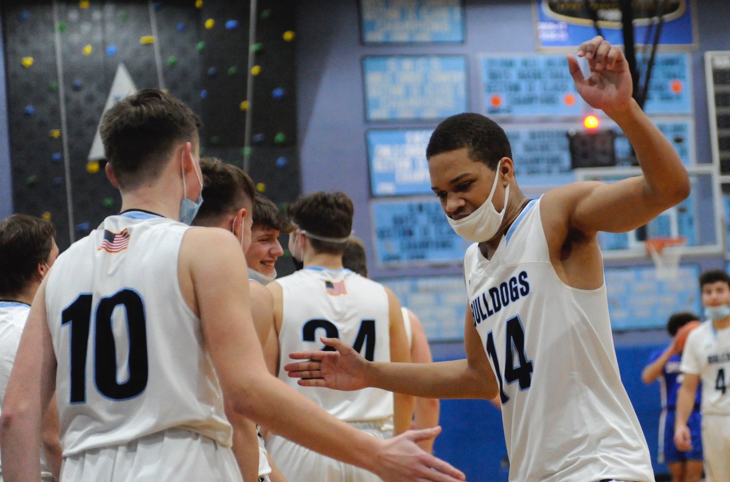 A “high five” on the lowdown. Sullivan West’s Ray Jones closed out the Bulldogs’ scoring with a “three” at the final buzzer. He was congratulated by his teammates including Matthew DuBois (pictured).